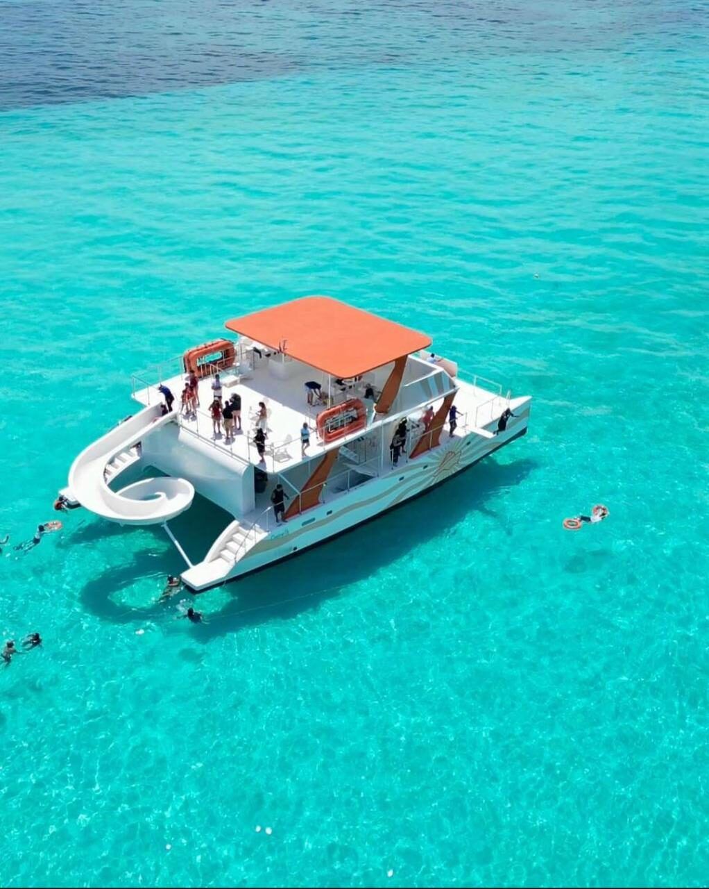 Two-deck party catamaran with water slide in Cancun for group events